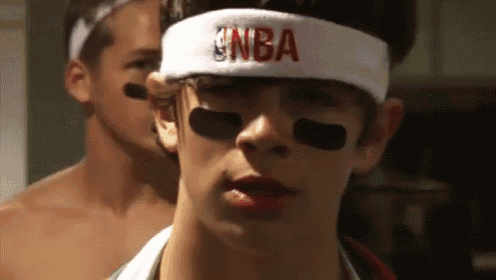 a man wearing a headband with the nba logo on it