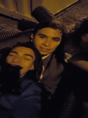 a group of young men are laying on the ground with their faces down