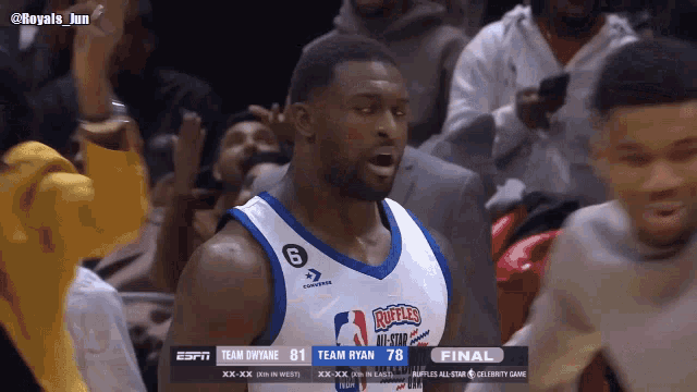 a basketball player wearing a jersey with ruffles on it