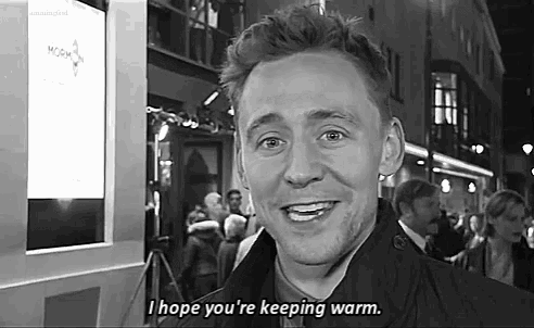 a man is smiling in a black and white photo and says `` i hope you 're keeping warm . ''