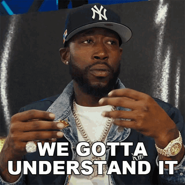 a man wearing a ny yankees hat says " we gotta understand it "