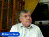 roberto scur is a man in a white shirt and tie