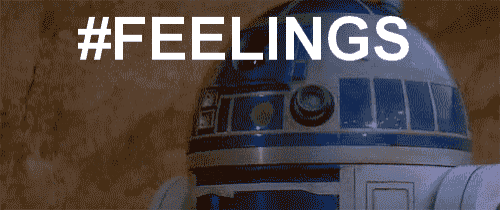 a r2d2 robot is laying on the ground with the words #feelings behind it