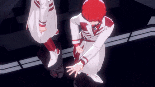 a man with red hair is standing next to another man in white