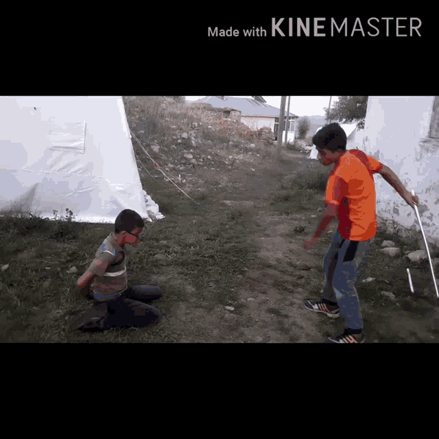 two boys are playing in a video that was made with kine master
