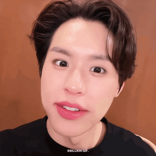 a close up of a person 's face with the words bbbillkin gif below