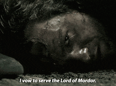 a man laying on the ground with the words " i vow to serve the lord of mordor " above him