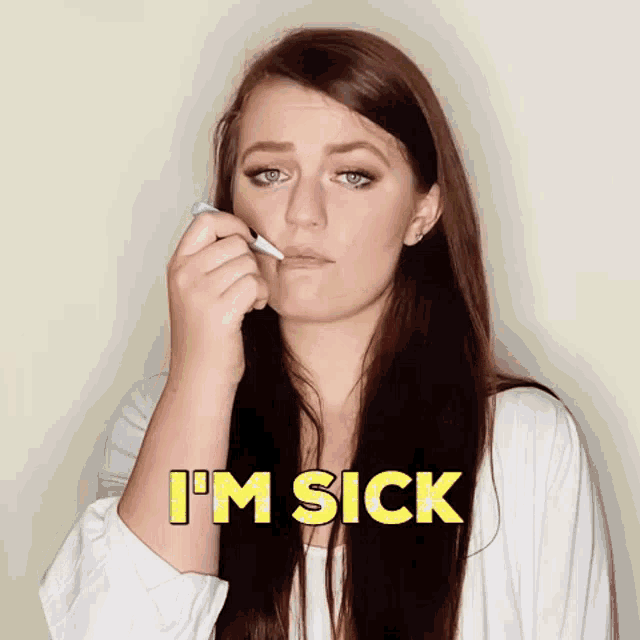 a woman is holding a marker to her mouth and says i 'm sick in yellow letters