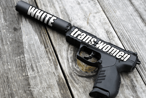 a black gun with a sticker that says white trans women