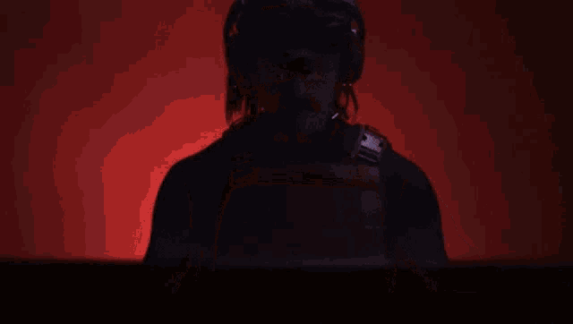 a man wearing a helmet and goggles has the letter t on his head