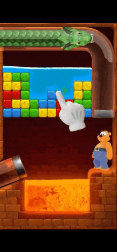 a hand is pointing at a block in a game while a man looks on .