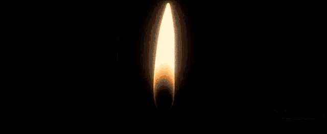 a pyramid with a flame coming out of it is surrounded by fire .