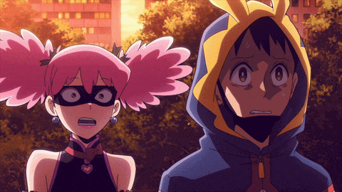 a boy and a girl are standing next to each other and the girl has pink pigtails