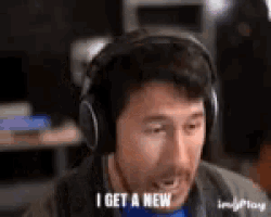 a man wearing headphones is making a funny face and saying i get a new .