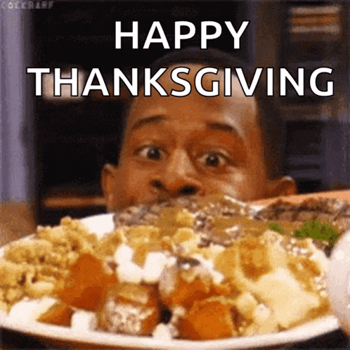 a man is eating a plate of food with the words happy thanksgiving written on the bottom .