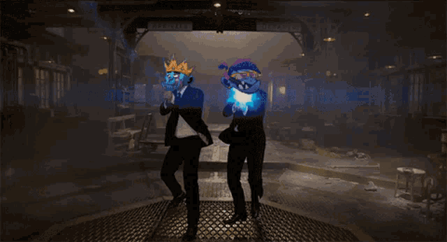 a man in a suit is standing next to another man in a suit with a mask on his face