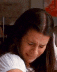 a close up of a woman 's face with her eyes closed .