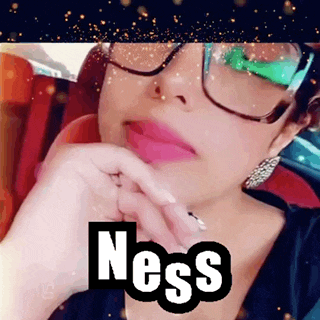 a woman wearing glasses with the word ness written on her face