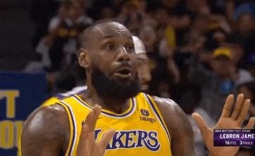 lebron james is wearing a yellow lakers jersey