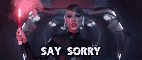 a woman in a black suit is holding a red flare and saying say sorry .