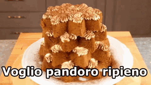 a cake on a plate with the words " voglio pandoro ripiena " below it