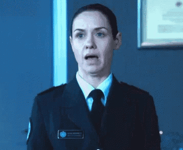 a woman in a police uniform with a name tag that says ' sally ' on it