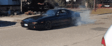 a black car with a license plate that says lc4