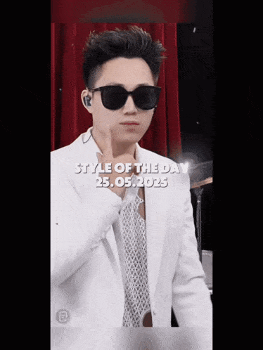 a man wearing sunglasses and a white suit says style of the day on the bottom