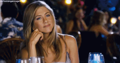 The Queen Of Wcw. GIF - Jennifer Aniston Hmm Smile GIFs