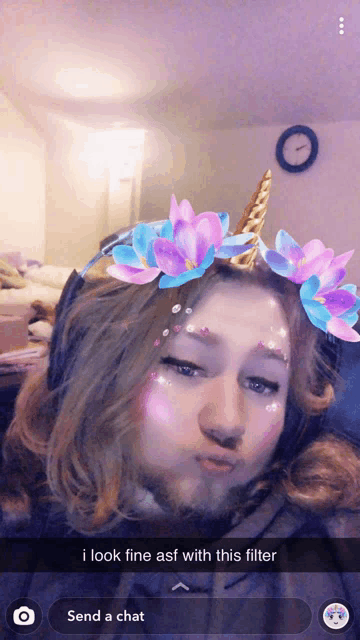 a girl with a unicorn headband and flowers on her face