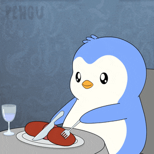 a penguin is sitting at a table with a plate of food and a glass of water
