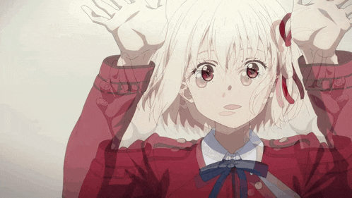 a girl with white hair and red eyes is wearing a red shirt