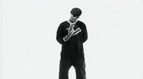 a man wearing a reebok shirt and a beret