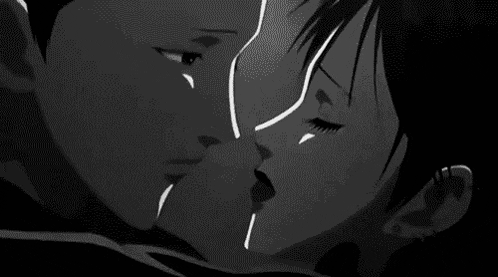 a man and a woman are standing in an elevator and talking to each other .