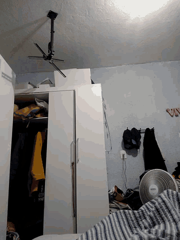 a room with a fan that says ' philips ' on the top of it