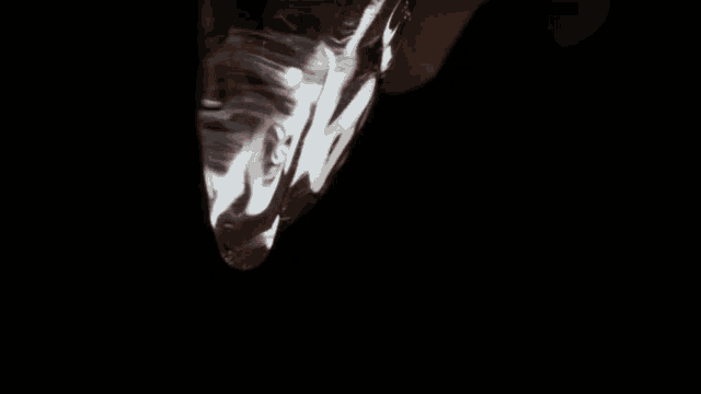 a close up of a person 's skin with a white shirt on