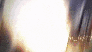 a blurry picture of a person 's face with the words on_top111 written in the corner