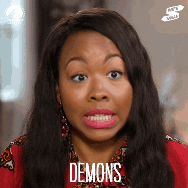 a woman is making a face and the word demons is on the bottom