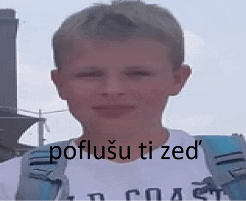 a young boy wearing a white t-shirt with the words poflusu ti zed on it
