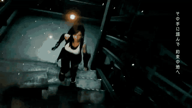 a woman is walking down a set of stairs in a dark room .