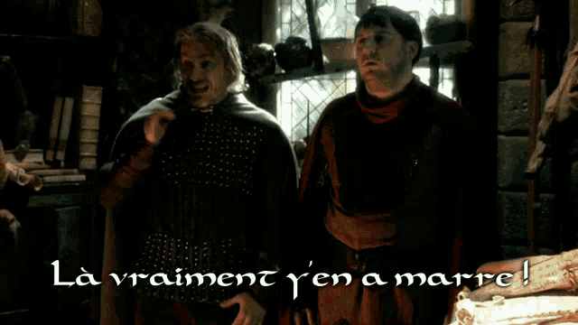 two men standing next to each other with the words la vraiment y'en a mare