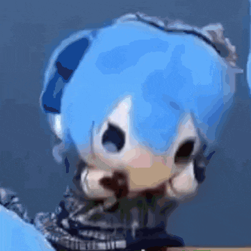 a close up of a doll with blue hair and headphones .