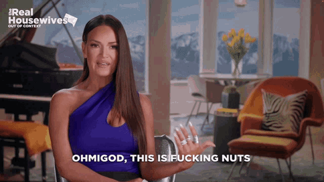 a woman says " ohmigod this is fucking nuts " in front of a piano