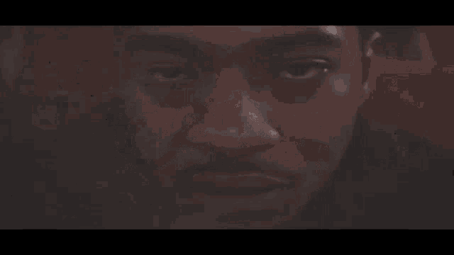 a close up of a man 's face with smoke coming out of his mouth and the words " coko " on the bottom