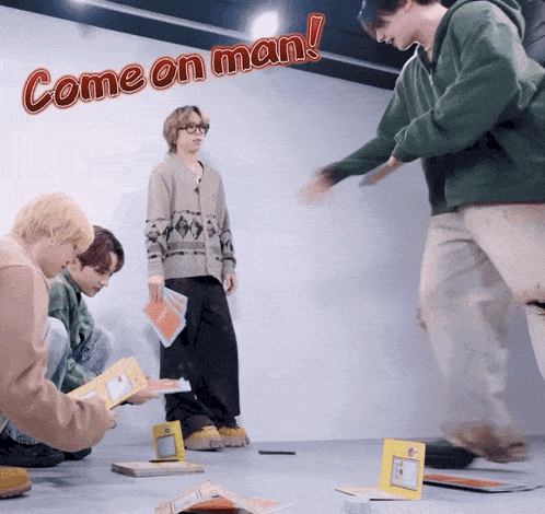 a group of people are playing a game with the words come on man