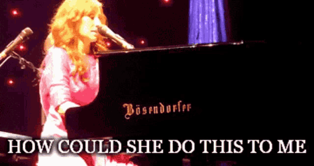 a woman singing into a microphone while playing a piano that says bosendorfer