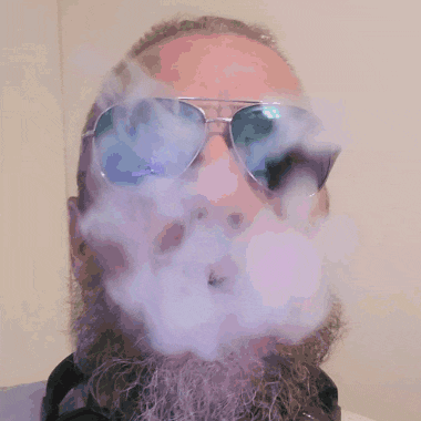 a man with a beard wears a pair of aviator sunglasses