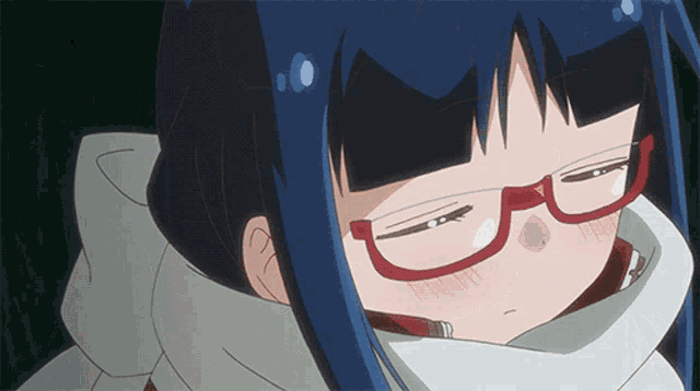 a close up of a girl wearing glasses and a scarf around her neck