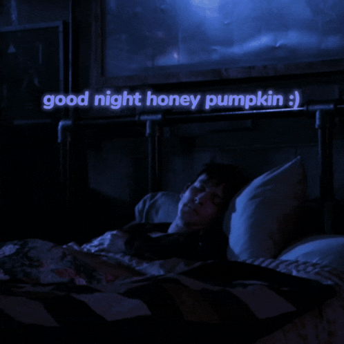 a man is sleeping in a bed with the words good night honey pumpkin written above him