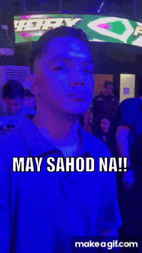 a man in a blue shirt with the words may sahod na written on his face